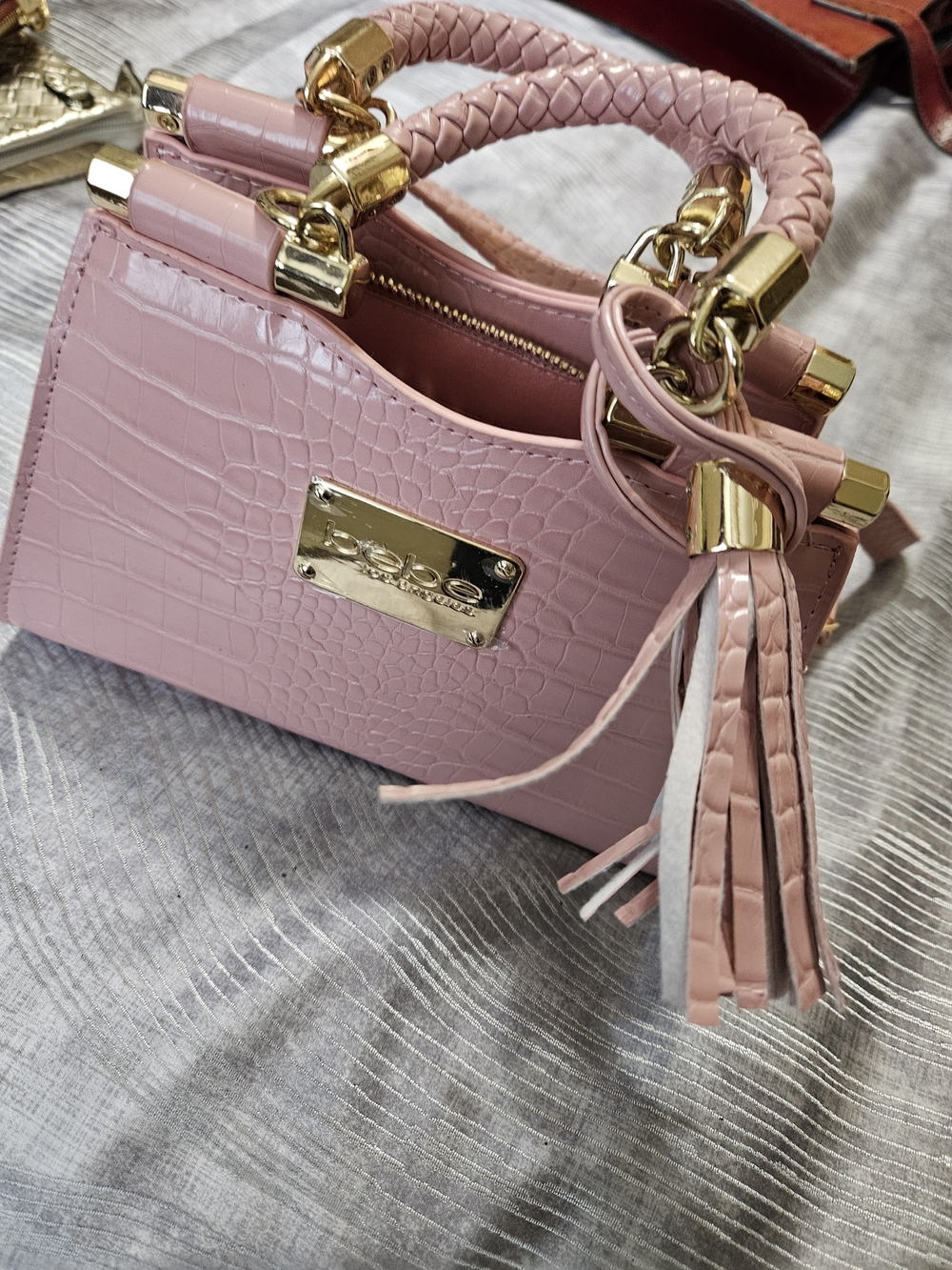 bebe mini crossbody features a glossy crocodile-embossed With Tassle